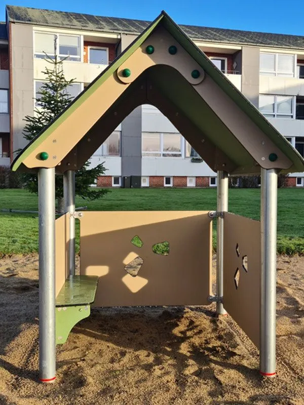 Playhouse Beth on the playground with bench front view Playhouse Beth on the playground with bench front view